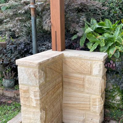 Rock faced sandstone L shaped column 