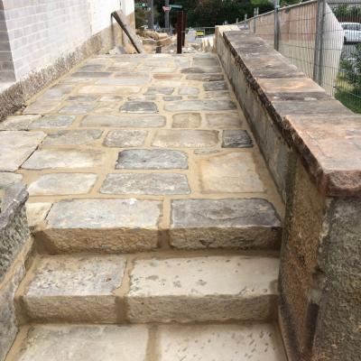 Restored & rebuilt heritage sparrow picked sandstone steps & paving area 
