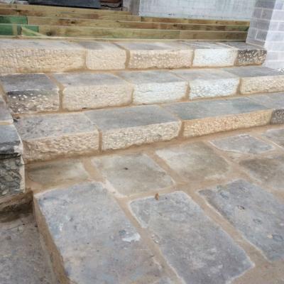 Hand crafted sparrow picked sandstone stairs