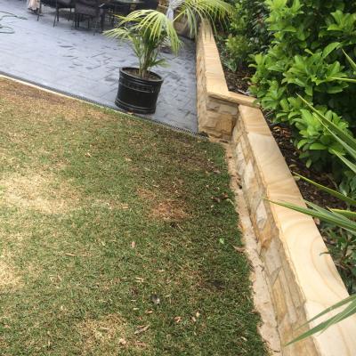 Rock faced sandstone block garden wall & rock faced coping 