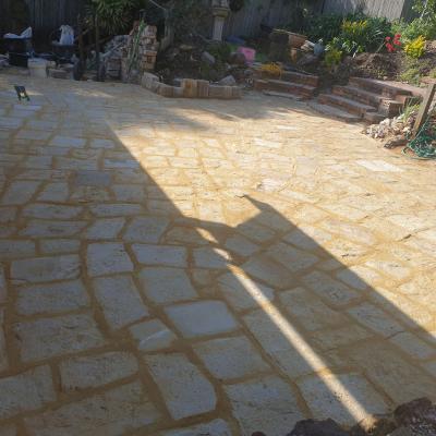 Light selection sandstone flagging outdoor area